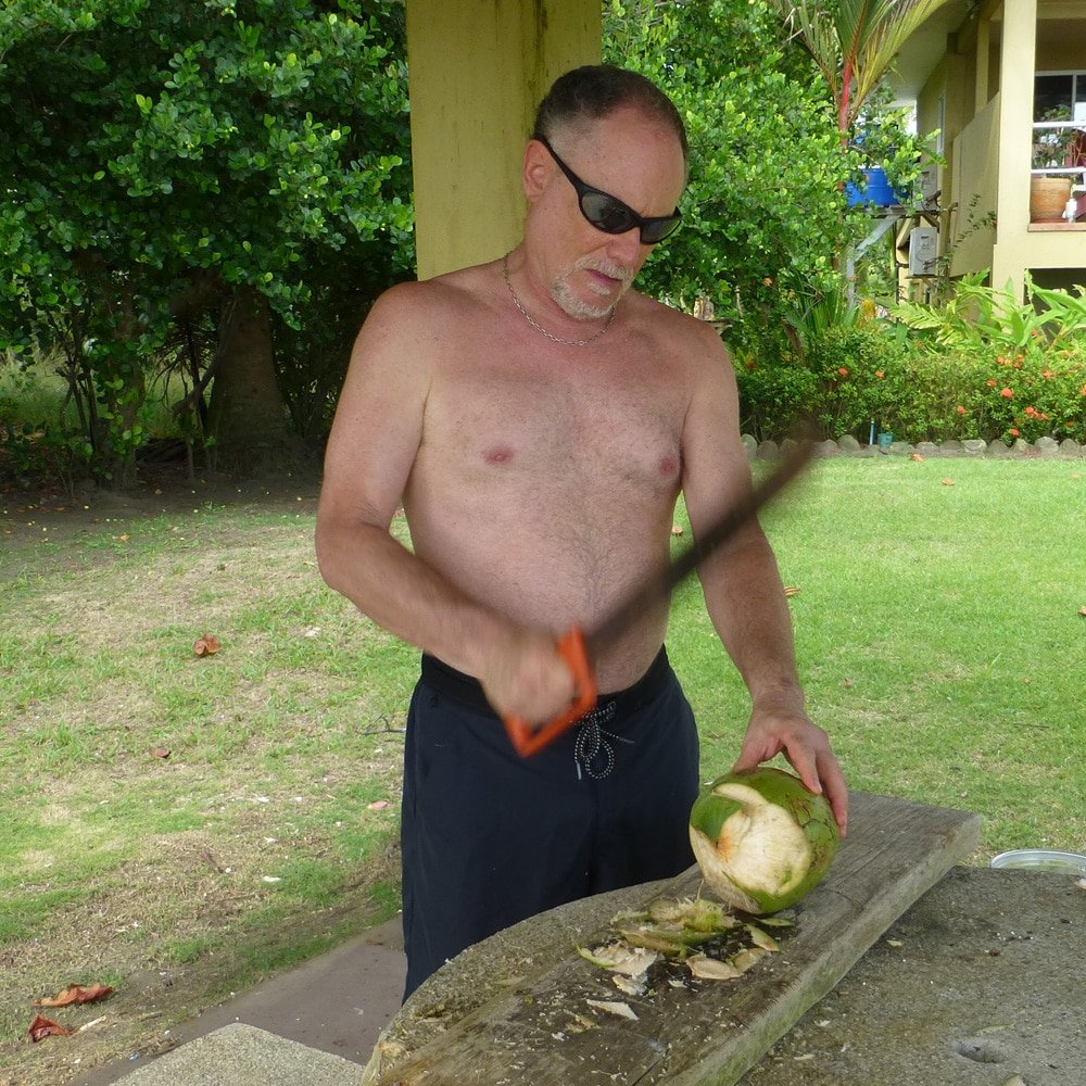 cutting open a young coconut in Costa Rica